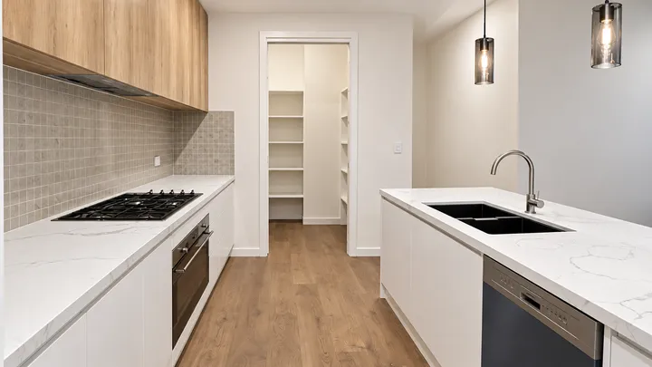 A finished new-build kitchen with walk-in pantry